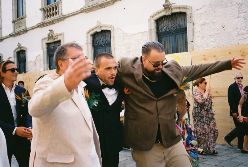 Groomsmen celebrating on film